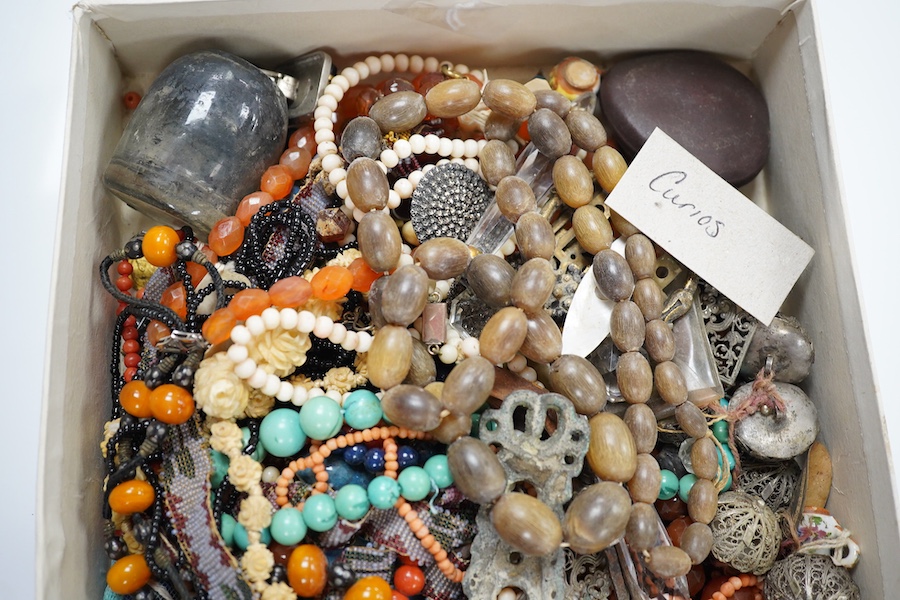 A mixed quantity of assorted jewellery and other items including carnelian agate, coral and amber necklaces, hair ornament, shells, spectacles, etc. Condition - poor to fair